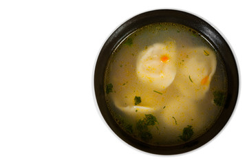 soup with dumplings - russian pelmeni, ravioli with meat. with copy space. top view. isolated on white
