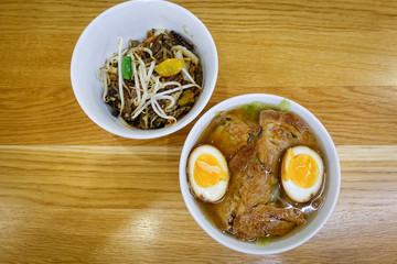 Bowls of Asian soup noodles and egg