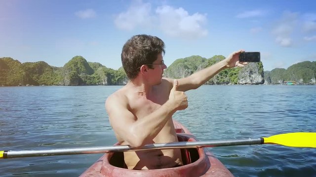 Guy in Glasses Makes Faces Selfie Put Paddle on Kayak Board