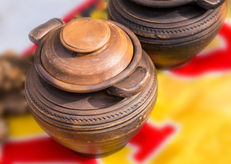 pot old clay round cap brown color covered with geometric ornament