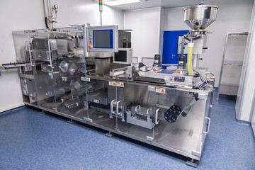photos sterile production area with the machine for the production of tablets and sorting