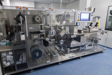 photos sterile production area with the machine for the production of tablets and sorting