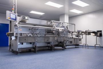 photos sterile production area with the machine for the production of tablets and sorting