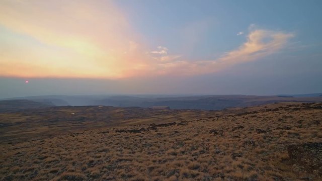 Pan of empty landscape at sunset from summit of Steens Mountain in fall 1