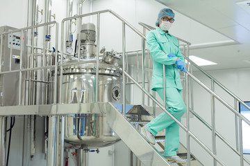 the operator controls the machine in the factory work