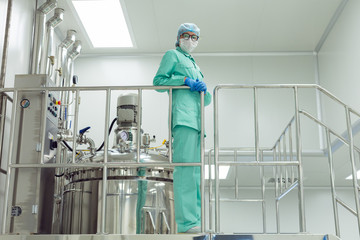 the operator controls the machine in the factory work