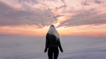 blonde girl on a background beautiful sunset