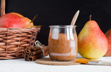 Homemade pear and cinnamon mask in a glass jar. Diy cosmetics. Copy space.