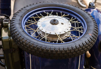 motorcycle wheel. Rim of a spoke on a background of a blue motorcycle retro techno background