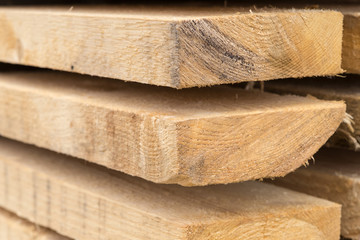 wooden background. Thick boards natural pattern, material for construction close-up