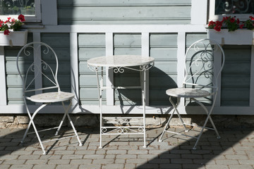 Table and chairs in outdoor cafe.