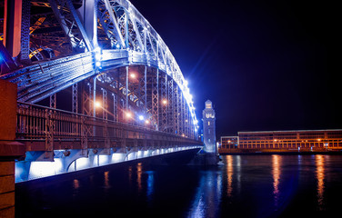 St. Petersburg blue neon luminous metal bridge at night
