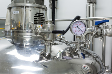 pressure meter on big steel tank
