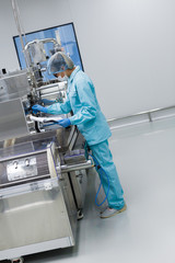 factory worker fix machine