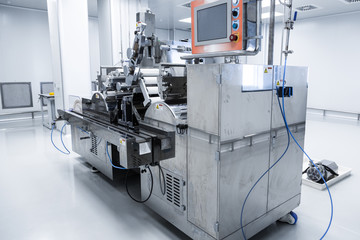 big steel chromed machine with shafts and control panel