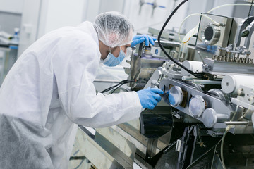 scientist fix manufacture machine in lab