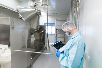 scientist stand near chromed barrels