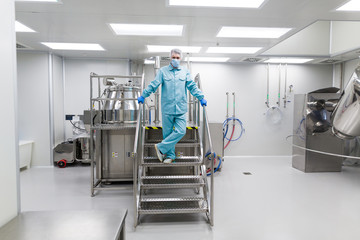 Fototapeta premium plant picture, scientist is standing on ladder in laboratory