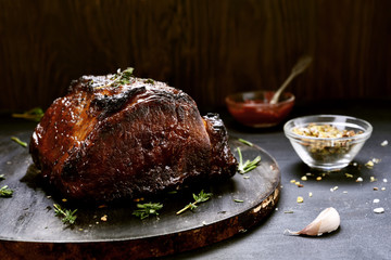 Baked pork on wooden board