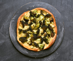 Pizza with broccoli and cheese