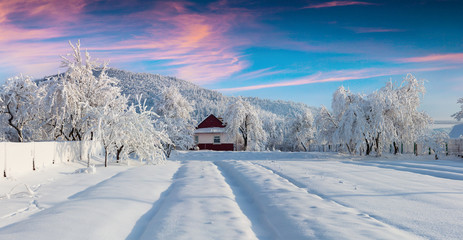 Sunny winter landscape in the mountain village
