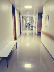 Nurse walking down a hospital hallway.