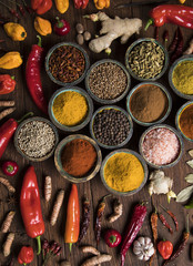 Spices and herbs in wooden bowls. Food and cuisine ingredients