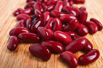 Red beans on a wooden background