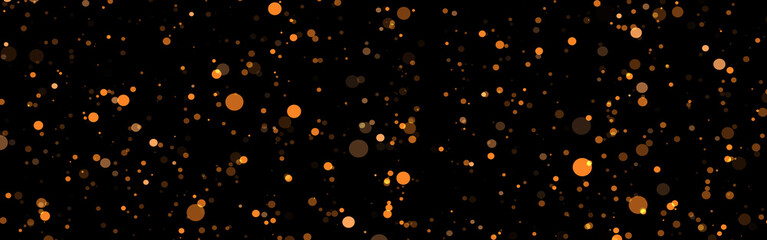 Golden abstract sparkles or glitter lights. Festive gold background. Defocused circles bokeh or...