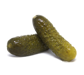 two pickles on the white background