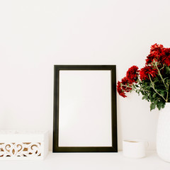 Photo frame mock up, beautiful red flowers bouquet, white vintage casket in front of white background.
