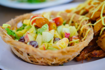 Fruit salad cream in taro basket