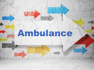Medicine concept:  arrow with Ambulance on grunge textured concrete wall background, 3D rendering