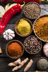 Variety of spices and herbs on kitchen table