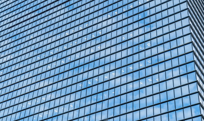 Fototapeta na wymiar Low angle view of financial district skyscraper glass
