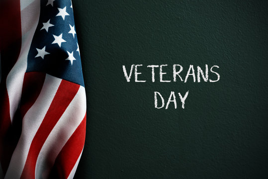 text veterans day and american flag