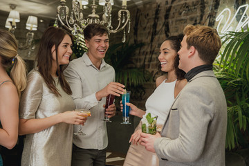 Friends Socialising Over Cocktails