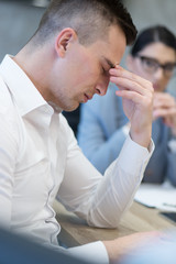 young businessman relaxing at the desk