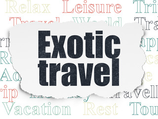 Fototapeta premium Tourism concept: Painted black text Exotic Travel on Torn Paper background with Tag Cloud