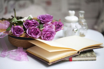 Pink roses and old books