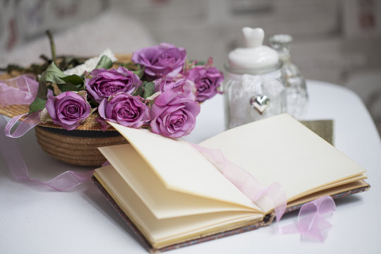 Pink roses and old books