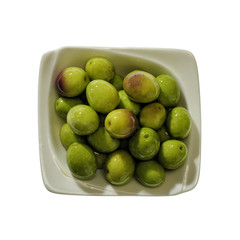 Bowl of olives on white background