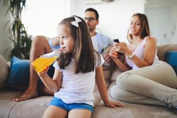 Young little girl enjoying time with her parents