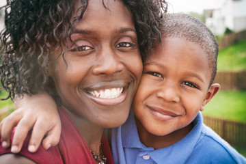 Family: Smiling Mother And Son Outdoors