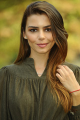 Fototapeta premium Young brunette woman portrait in autumn color.