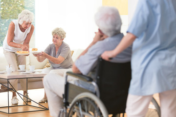 Senior woman eating cheesecake