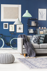 Lamps above grey sofa