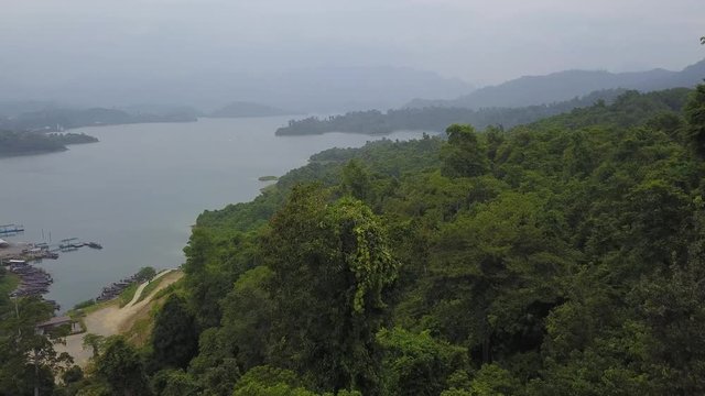 Aerial shot of tropical lake amon jungle lush green islands, rainy weather