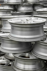 Wall of alloy old car wheels.