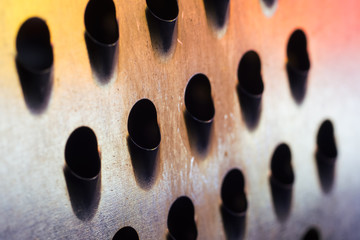 macro metal texture with hole. Grater. Abstract background